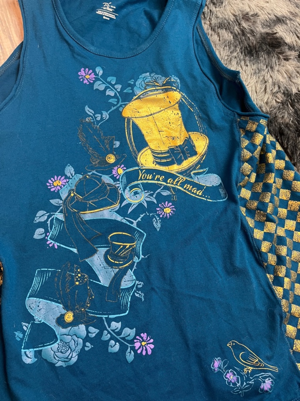 Disney Store Teal Tank Top with Mad Hatter Hat and “You’re all mad…” in Gold